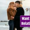 Side view of young couple in winter by the beach.