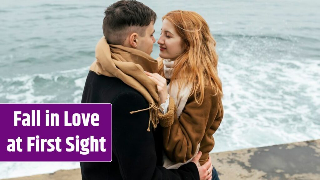 Couple by the lake during winter embraced.