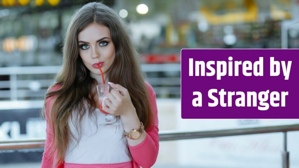 Young girl having a soda in a shopping center.